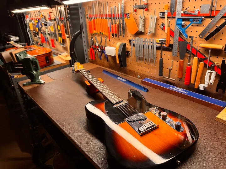 Guitar repair and setup at The Guitar Surgeon workshop, Auckland — April 2026