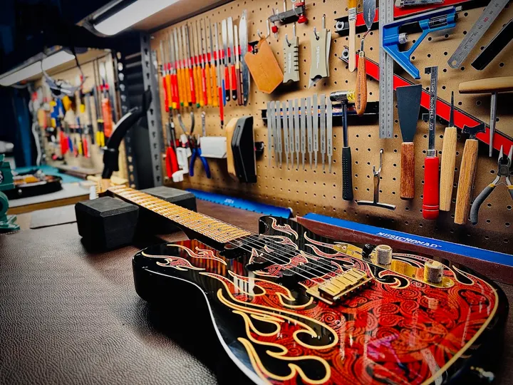 Guitar repair and setup at The Guitar Surgeon workshop, Auckland — May 2026