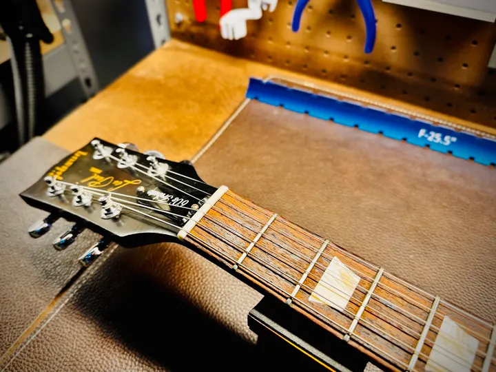 Guitar repair and setup at The Guitar Surgeon workshop, Auckland — May 2026