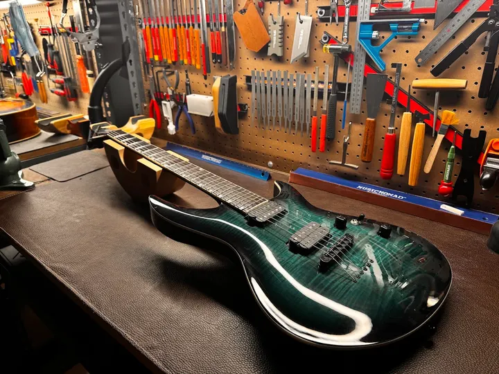 Guitar repair and setup at The Guitar Surgeon workshop, Auckland — May 2026