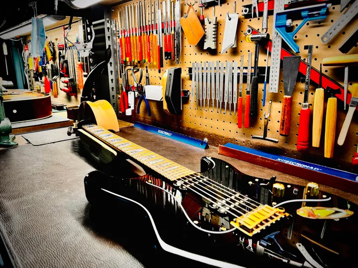Guitar repair and setup at The Guitar Surgeon workshop, Auckland — May 2026