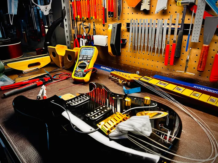 Guitar repair and setup at The Guitar Surgeon workshop, Auckland — May 2026