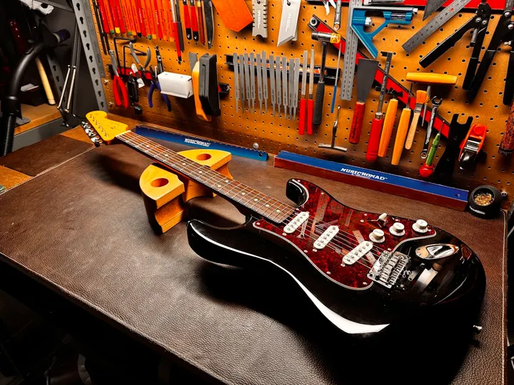 Guitar repair and setup at The Guitar Surgeon workshop, Auckland — June 2026