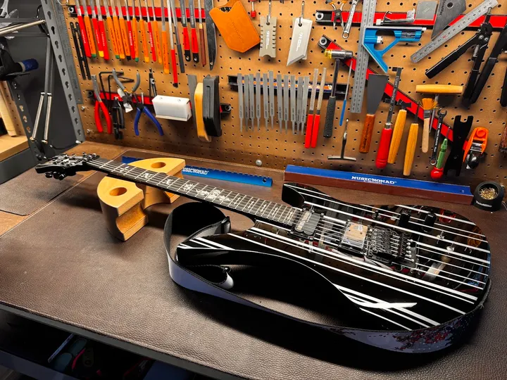 Guitar repair and setup at The Guitar Surgeon workshop, Auckland — June 2026