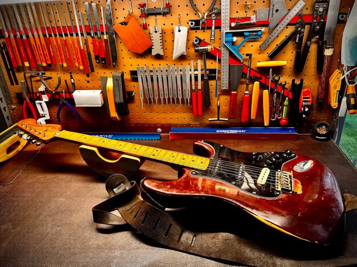 Guitar repair and setup at The Guitar Surgeon workshop, Auckland — June 2026