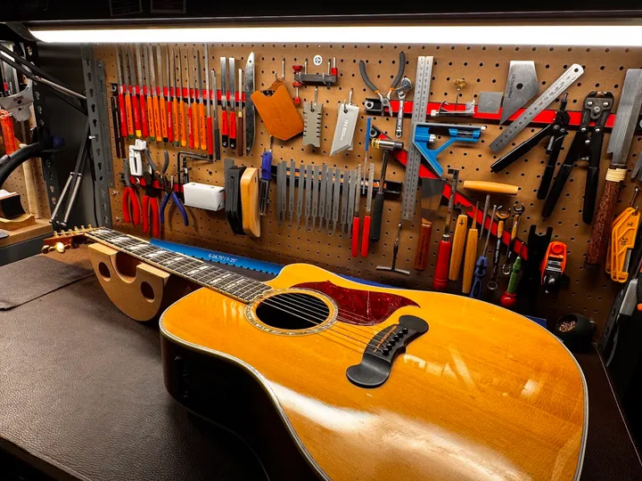 Guitar repair and setup at The Guitar Surgeon workshop, Auckland — July 2026