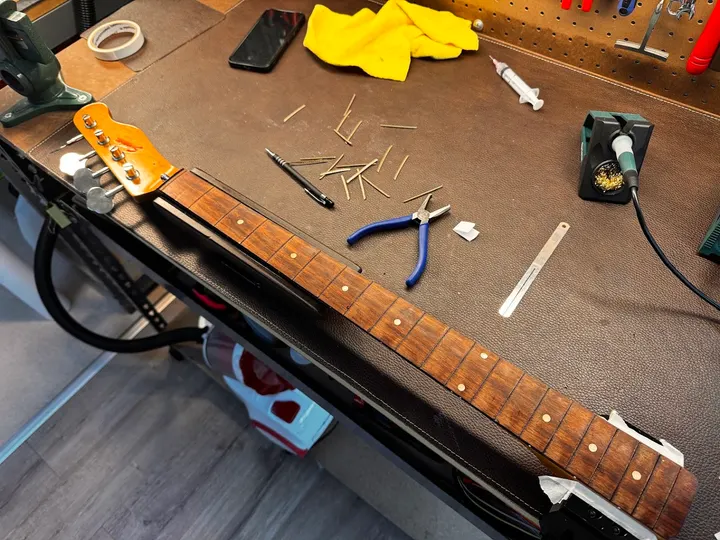 Guitar repair and setup at The Guitar Surgeon workshop, Auckland — July 2026