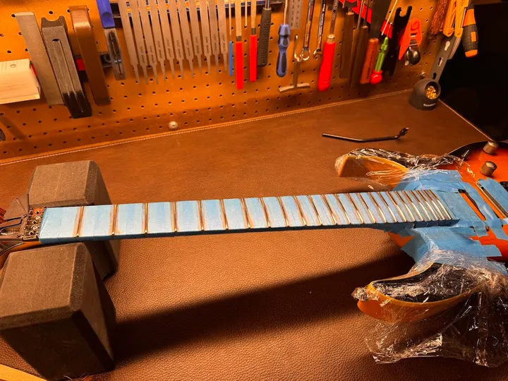 Guitar repair and setup at The Guitar Surgeon workshop, Auckland — August 2026