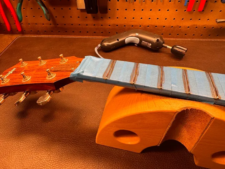 Guitar repair and setup at The Guitar Surgeon workshop, Auckland — August 2026