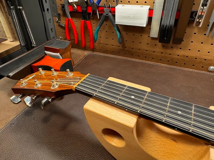 Guitar repair and setup at The Guitar Surgeon workshop, Auckland — August 2026