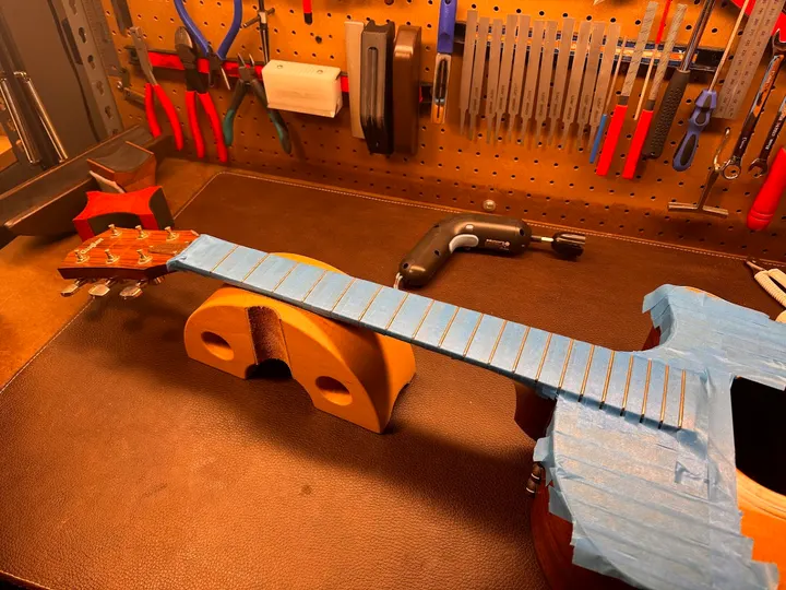 Guitar repair and setup at The Guitar Surgeon workshop, Auckland — August 2026