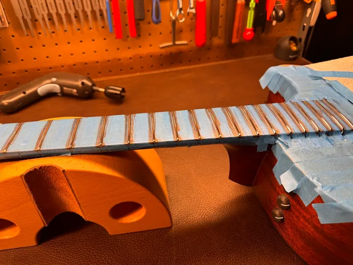 Guitar repair and setup at The Guitar Surgeon workshop, Auckland — August 2026