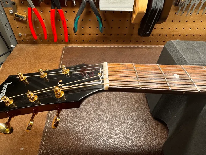Guitar repair and setup at The Guitar Surgeon workshop, Auckland — August 2026